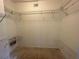 Walk-in closet with open shelving at 8158 Eagles Park N Dr, St Petersburg, FL 33709