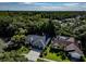 Aerial view of the property showcasing the home's layout, landscaping, and surrounding neighborhood at 910 Kingscote Ct, Safety Harbor, FL 34695