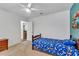Bedroom features a twin bed, carpet floors, and a neutral paint color at 910 Kingscote Ct, Safety Harbor, FL 34695