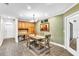 Charming dining room features a wooden table, neutral-colored walls, and views into the adjoining room at 910 Kingscote Ct, Safety Harbor, FL 34695