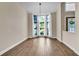 An empty formal dining area with a bay window and natural light offers a versatile living space at 910 Kingscote Ct, Safety Harbor, FL 34695