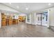 Open concept living room features kitchen, dining, and sliding glass doors to the outdoor patio at 910 Kingscote Ct, Safety Harbor, FL 34695