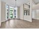 An open-concept living area with a bay window boasts great natural light and space for entertaining at 910 Kingscote Ct, Safety Harbor, FL 34695