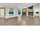 Living room showcasing tile floors, stone fireplace, and sliding glass doors to the pool at 910 Kingscote Ct, Safety Harbor, FL 34695