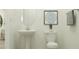 Well-lit half bath with a pedestal sink, modern toilet, and decorative wall art at 9509 Minnow Ray Dr, Land O Lakes, FL 34638