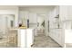 Modern kitchen with an island and bar seating, stainless steel appliances, and ample cabinet space at 9509 Minnow Ray Dr, Land O Lakes, FL 34638