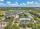 Expansive aerial view of condo community with lakes, landscaping, and golf course at 960 Starkey Rd # 10505, Largo, FL 33771