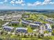 Expansive aerial view of condo buildings, golf course, ponds, and landscaping at 960 Starkey Rd # 10505, Largo, FL 33771