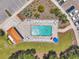 Aerial view of community pool area with ample seating and a covered pavilion at 960 Starkey Rd # 10505, Largo, FL 33771