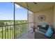 Screened balcony with seating, ceiling fan and views of the lovely golf course at 960 Starkey Rd # 10505, Largo, FL 33771