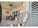 Screened balcony with seating, ceiling fan and views of the green golf course at 960 Starkey Rd # 10505, Largo, FL 33771