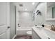 Bright bathroom with tub-shower, decorative fish, light-colored walls and neutral vanity at 960 Starkey Rd # 10505, Largo, FL 33771