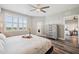 Serene bedroom featuring stylish window shutters, light gray walls, and wood-look flooring at 960 Starkey Rd # 10505, Largo, FL 33771