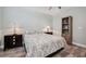 Well-lit bedroom has neutral walls and dark wood furniture at 960 Starkey Rd # 10505, Largo, FL 33771