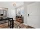 Charming dining area with wood-look floors, plantation shutters, and a stylish console table at 960 Starkey Rd # 10505, Largo, FL 33771