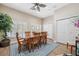 Bright dining room with wood table, chairs, white closet doors, and a rug at 960 Starkey Rd # 10505, Largo, FL 33771