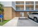 Exterior condo entrance with parking and signage showing building number and unit numbers, promoting convenient access at 960 Starkey Rd # 10505, Largo, FL 33771
