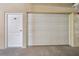 Attached one car garage with an entry door at 960 Starkey Rd # 10505, Largo, FL 33771