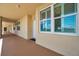 Condo hallway featuring neutral colors, exterior door, and window with natural light at 960 Starkey Rd # 10505, Largo, FL 33771