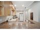 Functional kitchen featuring wood cabinets, light countertops, and modern appliances at 960 Starkey Rd # 10505, Largo, FL 33771