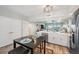 Spacious kitchen with modern appliances and an island table with seating for dining at 960 Starkey Rd # 10505, Largo, FL 33771