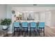 Open kitchen with bar seating, stainless appliances, and modern décor at 960 Starkey Rd # 10505, Largo, FL 33771