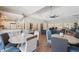 Bright community lounge area with comfortable seating, tables, and modern lighting fixture at 960 Starkey Rd # 10505, Largo, FL 33771