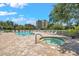 Community pool with a hot tub and plenty of seating at 960 Starkey Rd # 10505, Largo, FL 33771