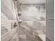 Glass shower features unique tile and a corner seat at 960 Starkey Rd # 10505, Largo, FL 33771
