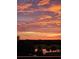Beautiful pink sunset view from the balcony of the pond and golf course at 960 Starkey Rd # 10505, Largo, FL 33771