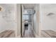 Between walk-in closets with gray floors that leads to the main bedroom at 960 Starkey Rd # 10505, Largo, FL 33771