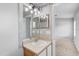 Bathroom featuring a vanity with a mirror and a neutral color palette with a doorway to another room at 9907 Carlsdale Dr, Riverview, FL 33578