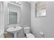 Bathroom features a pedestal sink, toilet, and neutral paint at 9907 Carlsdale Dr, Riverview, FL 33578