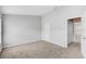 Neutral bedroom features plush carpet, light walls and a closet for ample storage space at 9907 Carlsdale Dr, Riverview, FL 33578