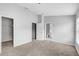 Spacious bedroom with neutral paint, plush carpet, and a closet with access to the bathroom at 9907 Carlsdale Dr, Riverview, FL 33578
