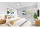 Bright, virtually staged bedroom with contemporary decor, complemented by a ceiling fan at 9907 Carlsdale Dr, Riverview, FL 33578