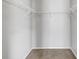 Walk-in closet with wall-mounted shelving, providing efficient storage for clothes and accessories at 9907 Carlsdale Dr, Riverview, FL 33578
