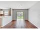 Open dining room with hardwood floors and sliding glass doors to the outdoor space at 9907 Carlsdale Dr, Riverview, FL 33578