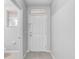 Bright entryway featuring neutral walls and a six-panel front door at 9907 Carlsdale Dr, Riverview, FL 33578