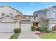 Charming townhome featuring a two-car garage and well-maintained landscaping, making it an inviting and welcoming home at 9907 Carlsdale Dr, Riverview, FL 33578