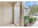 Cozy front porch with decorative columns and landscaped garden at 9907 Carlsdale Dr, Riverview, FL 33578