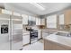 Well-equipped kitchen with stainless steel appliances and ample counter space at 9907 Carlsdale Dr, Riverview, FL 33578