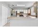 Bright kitchen features stainless steel appliances, light countertops, and stylish tiled backsplash at 9907 Carlsdale Dr, Riverview, FL 33578