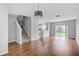 Spacious living room with wood floors and access to the backyard at 9907 Carlsdale Dr, Riverview, FL 33578