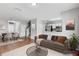 Open living room with hardwood floors, neutral paint and open concept kitchen view at 9907 Carlsdale Dr, Riverview, FL 33578