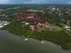 Aerial view showcasing the estate-sized property with waterfront access, docks, and stunning residences at 10930 Spring St, Largo, FL 33774
