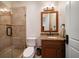 Stylish bathroom with tiled shower, granite vanity, and modern fixtures, offering a spa-like experience at 10930 Spring St, Largo, FL 33774