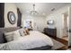 Spacious bedroom with hardwood floors, walk-in closet, and home office, providing a functional and inviting space at 10930 Spring St, Largo, FL 33774