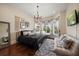 Inviting bedroom with large windows, hardwood floors, and comfortable furnishings, offering a relaxing space at 10930 Spring St, Largo, FL 33774