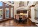 The dining room offers outdoor views, a bar area, hardwood floors, and unique light fixtures at 10930 Spring St, Largo, FL 33774